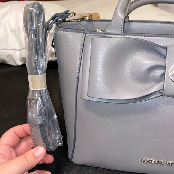 Purse with bow design on front. Brand new with tag. Gray purse. - Picture 5 of 16